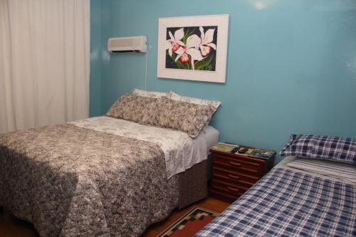 En eller flere senge i et værelse på Pousada Charme da Serra