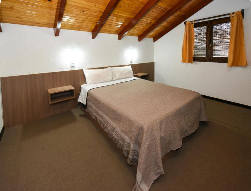 Postel nebo postele na pokoji v ubytování Cabañas Los Moye