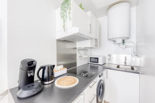Η κουζίνα ή μικρή κουζίνα στο Superbe appartement au Sud de Paris