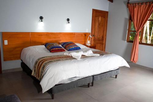 Ein Bett oder Betten in einem Zimmer der Unterkunft Rio Quijos EcoLodge