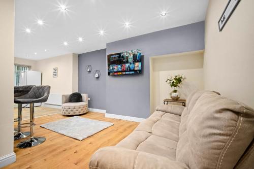 a living room with a couch and a chair at Harborne House, Perfect for Contractors & Families, sleeps 8 in Birmingham