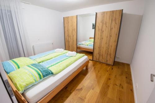 a bedroom with a bed and a mirror at Quiet House - 10 min away from Cologne in Bergisch Gladbach