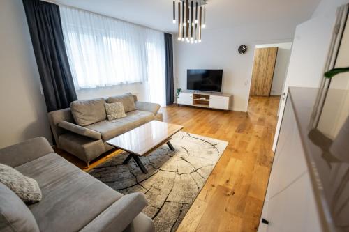 a living room with a couch and a table at Quiet House - 10 min away from Cologne in Bergisch Gladbach