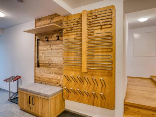 a wooden wall with a bench in a room at Chalet Bergglück in Sellrain