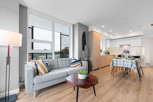 a living room with a couch and a table at Brand new Stylists Richmond central 2B2BR in Richmond