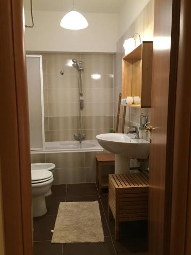 a bathroom with a toilet and a sink and a shower at La terrazza sul borgo in Serracapriola
