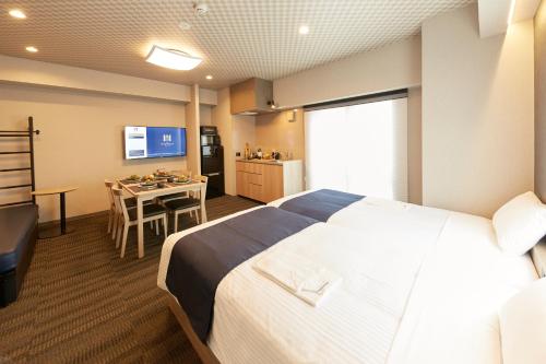 Postel nebo postele na pokoji v ubytování MONday Apart Premium UENO OKACHIMACHI