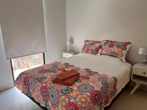 Una cama o camas en una habitación de Fabuloso! cerca de todo! Mariale