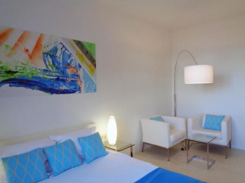 Postel nebo postele na pokoji v ubytování Hotel Apartment Puell