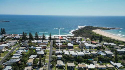 an aerial view of a suburb with houses and the beach at Sunset House - Oceanstays in Yamba