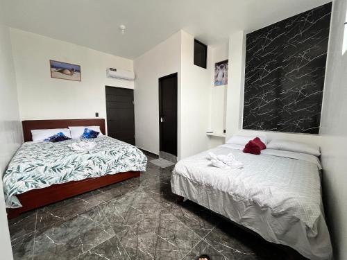 Una cama o camas en una habitación de La Casa D Juan