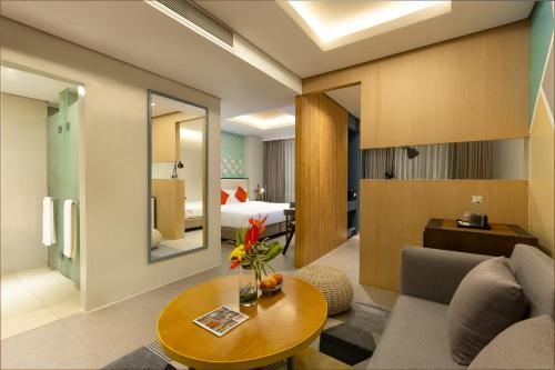 a living room with a couch and a table at Summit Galleria Cebu in Cebu City