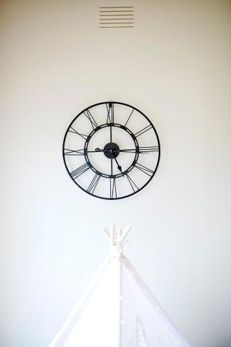 a clock on the top of a building at 4 Bedroom Home in Heathmont Perfect for Families in Heathmont