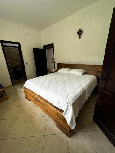 Una cama o camas en una habitación de Finca Las Palmas