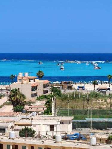 a view of a beach with boats in the water at See you soon Matrouh 1 in Marsa Matruh