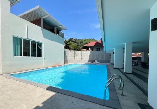 a swimming pool in the backyard of a house at Royal Kamala - 1 separated bedroom Condo in Kamala Beach