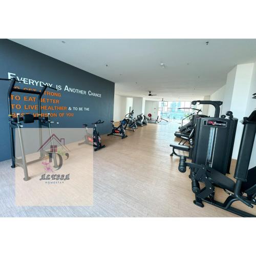 a gym with treadmills and exercise bikes in a room at D' Alyssa Homestay Perda in Bukit Mertajam