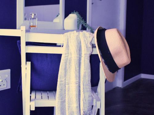 a table with a hat and a towel on a chair at The Daiquiri Shaq in St Helena Bay