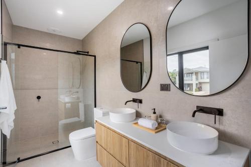 a bathroom with two sinks and a mirror at You Yangs Vista in Portarlington
