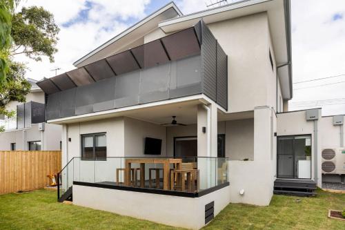 a white house with a black and white facade at You Yangs Vista in Portarlington
