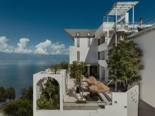 a view of the water from the balcony of a building at 大理空岛半山海景民宿 in Dali