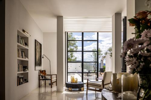 a living room with a large window and a couch at 大理空岛半山海景民宿 in Dali