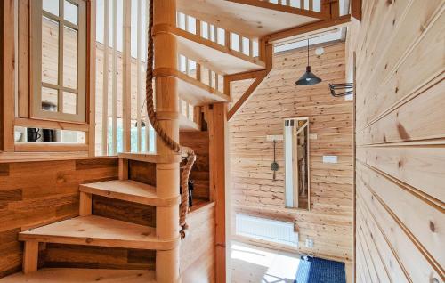 a wooden staircase in a tiny house at 1 Bedroom Nice Apartment In Ljungbyhed in Ljungbyhed