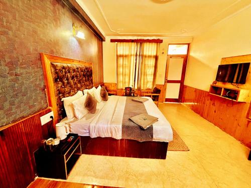 TV a/nebo společenská místnost v ubytování Elena Aastha - Valley View Rooms