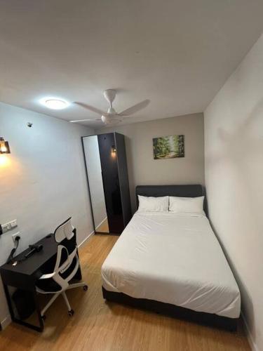 a bedroom with a bed and a desk and a bed sidx sidx sidx at Edumetro B32 3 Bedroom Subang Sunway By MICASA GROUP in Subang Jaya