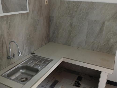 a kitchen with a sink and a counter top at G Lova House -Tetebatu in Tetebatu