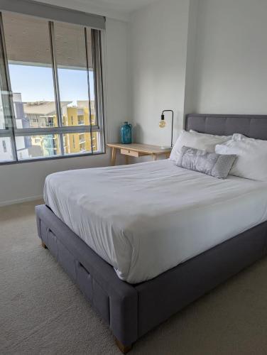 Кровать или кровати в номере Ridge Apartment Hotel