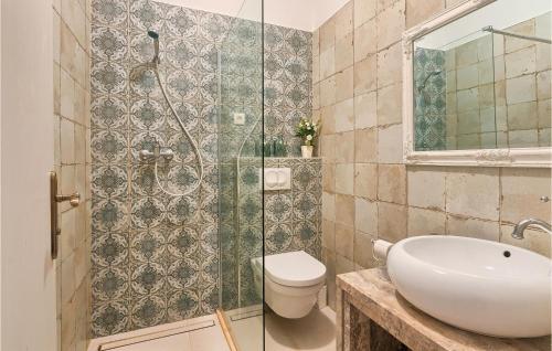 a bathroom with a toilet and a glass shower at Gorgeous Home In Buzet in Buzet
