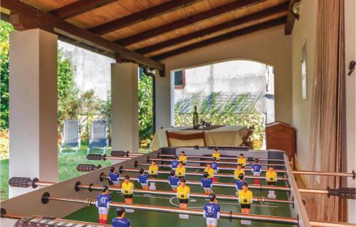 a group of lego people in a ping pong table at Awesome Home In Fazana With Kitchen in Fažana