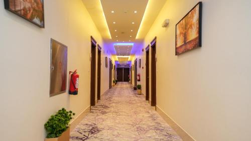 a corridor of a building with at هذه ليلتي- اليرموك- طريق الدمام This Lailaty Al Yarmouk-Dammam Road in Riyadh