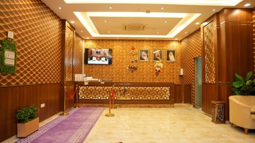 a lobby of a hotel with a tile wall at هذه ليلتي- اليرموك- طريق الدمام This Lailaty Al Yarmouk-Dammam Road in Riyadh
