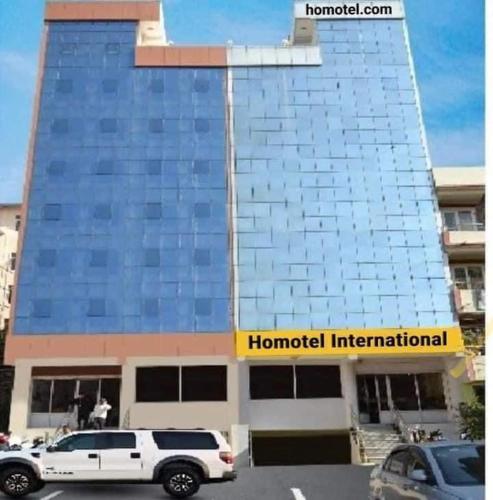 a white truck parked in front of a building at Ho-Motel International in Kathmandu