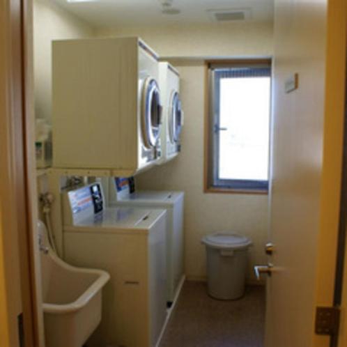 a bathroom with a sink and a toilet and a window at Ryugasaki Plaza Hotel Shinkan in Ryūgasaki