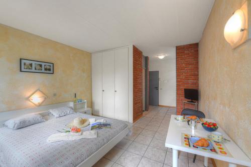 Katil atau katil-katil dalam bilik di Chiasso Apartments