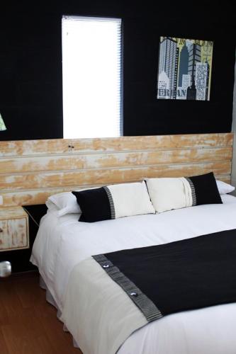 Postel nebo postele na pokoji v ubytování Casas Puerto de Vega