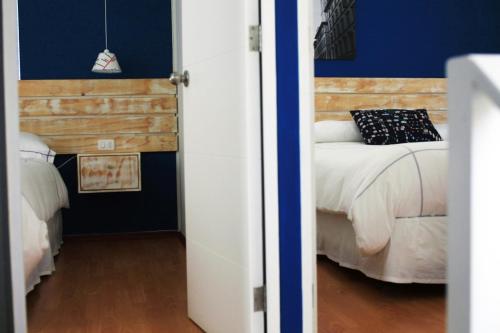 Postel nebo postele na pokoji v ubytování Casas Puerto de Vega