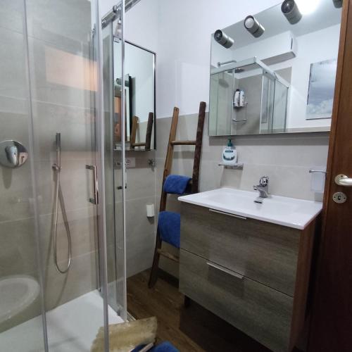 a bathroom with a sink and a shower at New Condominio Royal in Sestriere