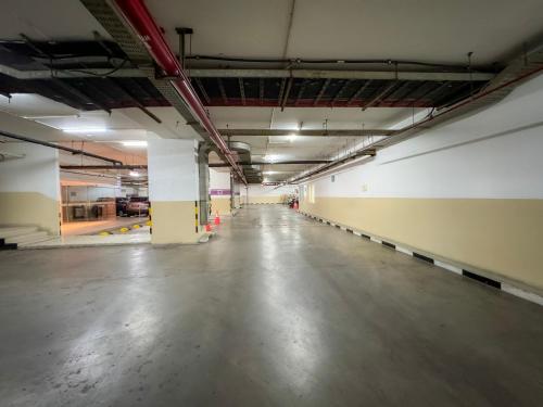 an empty parking garage with a long empty floor at Crowne Plaza Bandung by IHG in Bandung