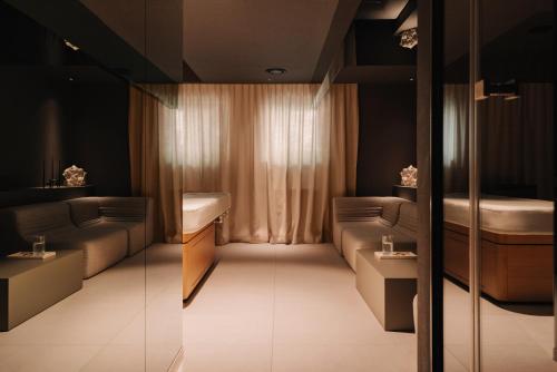 a room with two beds and a window at Poziom 511 Jura Wellness Hotel & Spa in Ogrodzieniec
