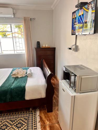 Ένα ή περισσότερα κρεβάτια σε δωμάτιο στο Creekside Guest House Middelburg
