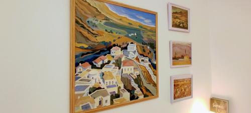 a painting hanging on a wall at Venieri's Stone Villa in Tsagarada