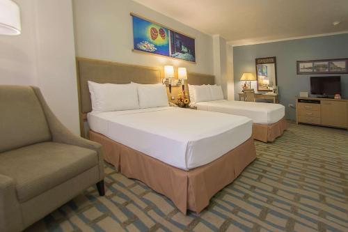 Ένα ή περισσότερα κρεβάτια σε δωμάτιο στο Grand Hotel Guayaquil, an Ascend Collection Hotel