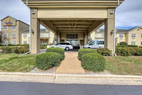 a parking lot in front of a building at Comfort Suites Appleton Airport in Appleton