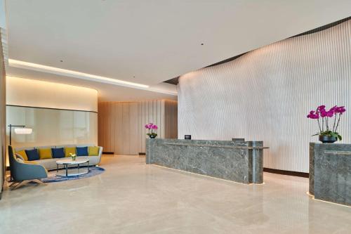 a lobby of a hotel with a waiting room at DoubleTree by Hilton Zhuhai Hengqin in Zhuhai