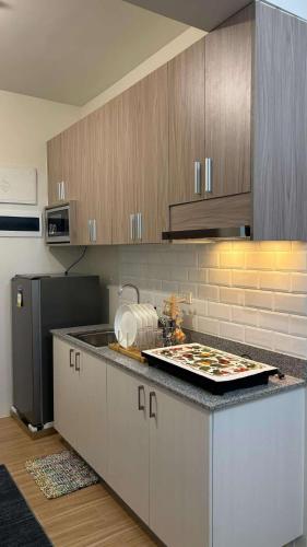 a kitchen with a sink and a counter top at Prestige Suite at Tulip Gardens Southwoods in Jalang