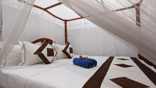 a bedroom with a bed in a tent at Hirikatiya Edge in Dickwella